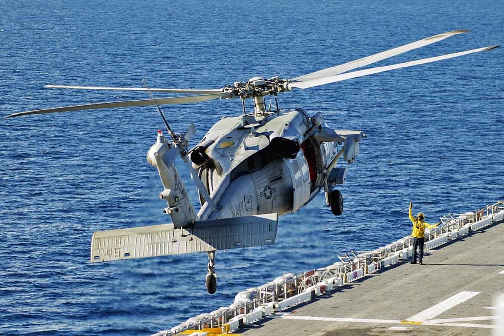 140903-N-QM905-004 ATLANTIC OCEAN (Sept. 3, 2014) An MH-60S Sea Hawk helicopter assigned to  Helicopter Sea Combat Squadron (HSC) 28 conducts flight operations aboard the Wasp-class amphibious assault ship USS Iwo Jima (LHD 7). Iwo Jima is underway conducting amphibious integration exercises. (U. S. Navy photo by Mass Communication Specialist Seaman Shelby Tucker/Released)