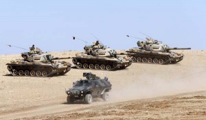 Turkish army tanks take up position on the Turkish-Syrian border near the southeastern town of Suruc in Sanliurfa province