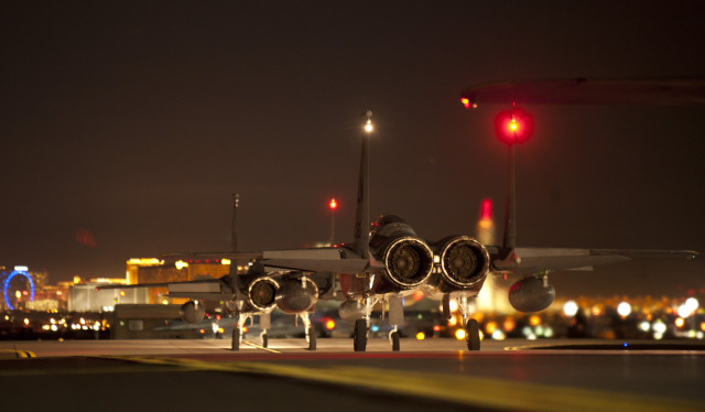 F-15C Eagles assigned to the 493rd Fighter Squadron, Royal Air Force Base, Lakenheath, England, taxi towards the runway moments before taking off to participate in a Red Flag 15-1 training sortie at Nellis Air Force Base, Nev., Feb. 4, 2015. The night operations aspects of Red Flag is crucial for aircrews looking to gain experience in low-light situations, giving U.S. and coalition Air Forces the strategic upper hand in current and future conflicts. (U.S. Air Force photo by Airman 1st Class Joshua Kleinholz)