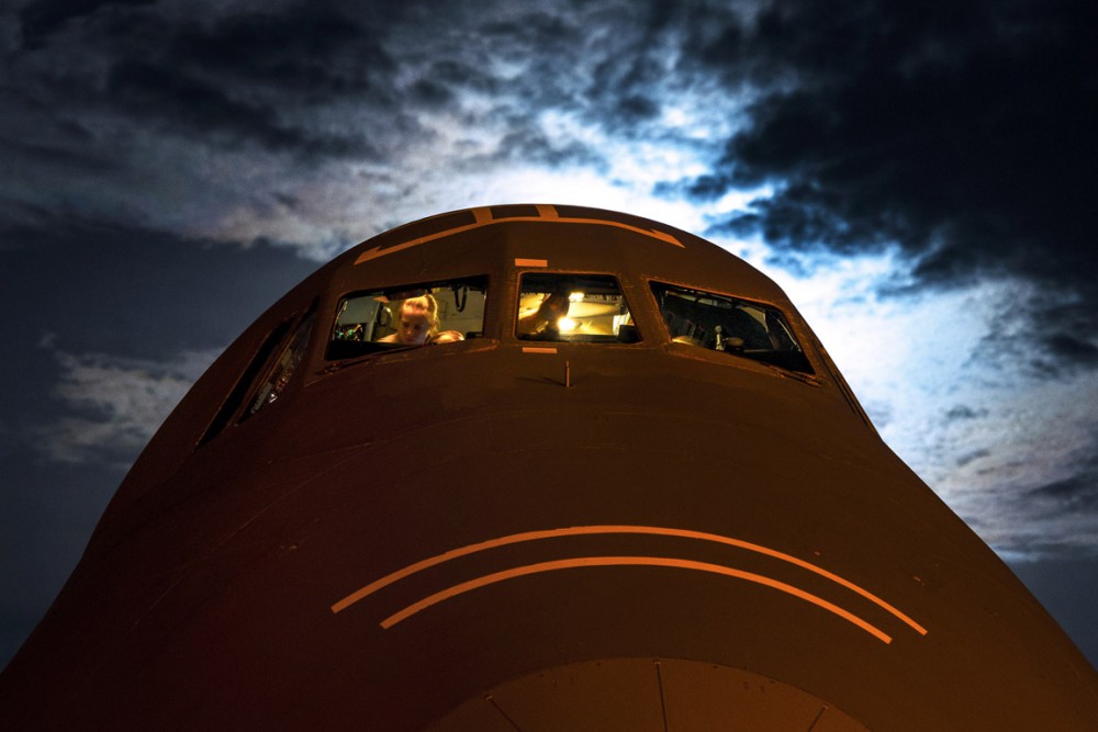 West Virginia Air National Guard aircrew members with the 167th Airlift Wing out of Martinsburg, W. Va., perform post flight checks inside the cockpit of a C-5 Galaxy July 22, 2013, at Joint Base Charleston - Air Base, S.C. Airmen from the 167th AW loaded cargo onto the C-5 to be used to support Operation Enduring Freedom. The C-5 is one of the largest aircraft in the world and the largest airlifter in the Air Force inventory. (U.S. Air Force photo/ Senior Airman Dennis Sloan)