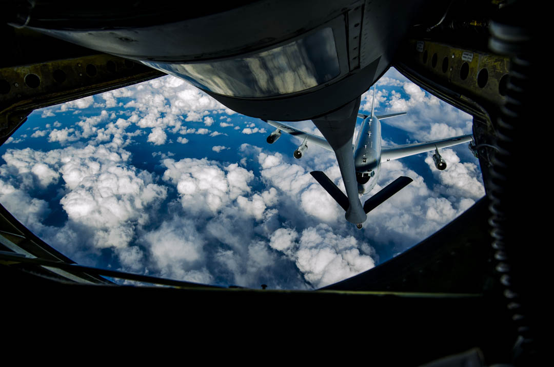 A U.S. Air Force KC-135 Stratotanker refueling aircraft from the 909th Air Refueling Squadron refuels a U.S. Air Force E-8C Surveillance Target Attack Radar System aircraft Jan. 29, 2013. The 909th Air Refueling Squadron provides combat ready KC-135 tanker aircrews to support peacetime operations in all levels of conflict in the Pacific theater. (U.S. Air Force photo/Airman 1st Class Tyler Prince)