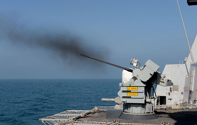 HMS Dragon fires her 30 mm gun during trials, prior to deployment in the Persian Gulf.