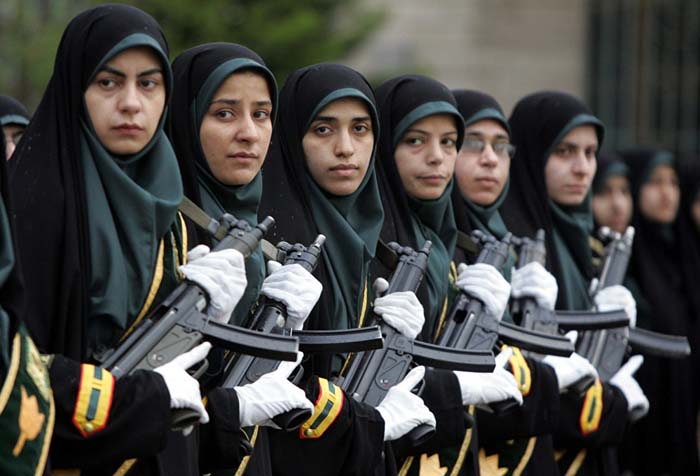 Iranian policewomen participate in a parade during a graduation ceremony at the Police Academy in Tehran. 11 March 2006.