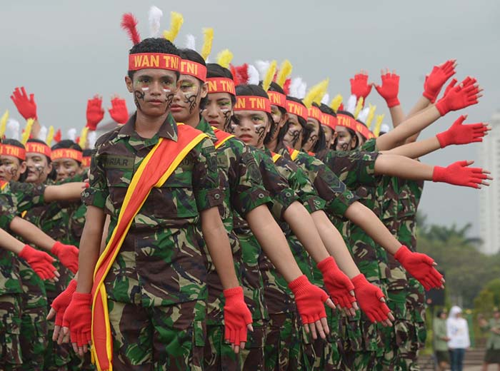 Female members of the Indonesian armed forces stage a performance during Kartini Day celebration in Jakarta. April 22, 2013.