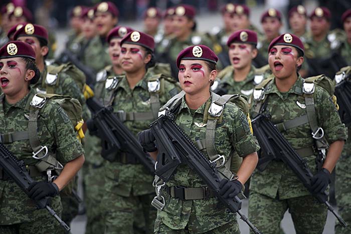 Mexican female paratroopers participate in a military parade held on the Independence Day in Mexico City. September 16, 2015.